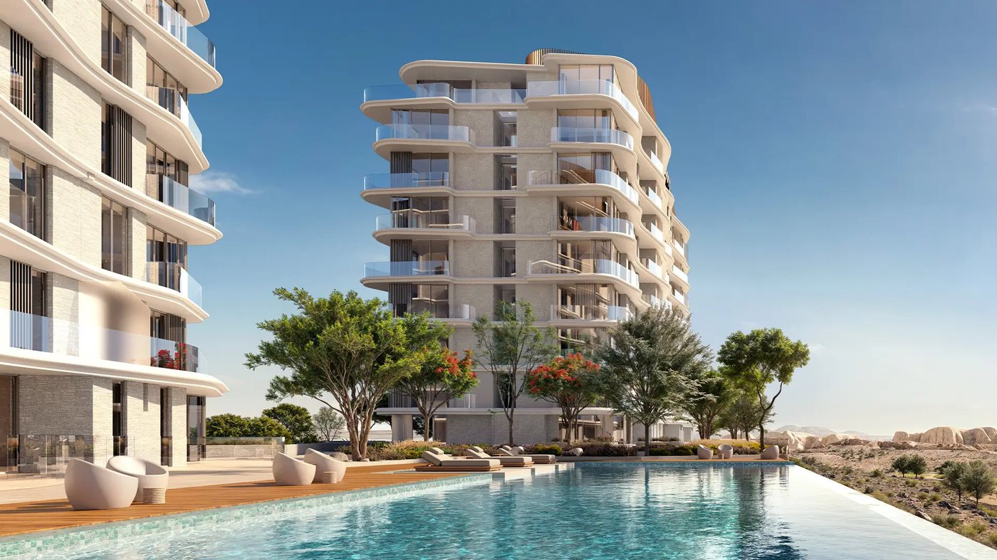 Infinity pool and terrace beside a Marriott Residences AIDA tower